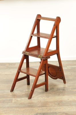 Lot 1347 - AN ARTS AND CRAFTS WALNUT METAMORPHIC LIBRARY CHAIR / STEPS