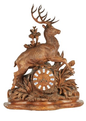 Lot 975 - A LARGE 19TH CENTURY CARVED LINDEN WOOD BLACK FOREST MANTEL CLOCK