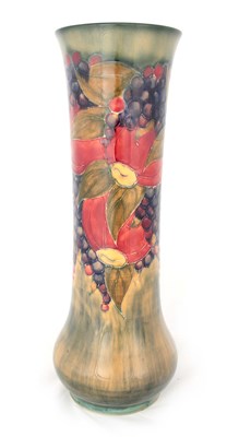 Lot 47 - AN EARLY WILLIAM MOORCROFT FLARED TALL SLENDER VASE WITH SWOLLEN FOOT