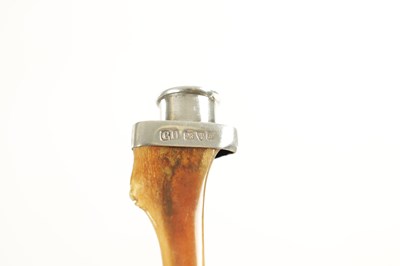 Lot 327 - A GEORGE V SILVER MOUNTED HARE BONE CIGARETTE/CIGAR HOLDER