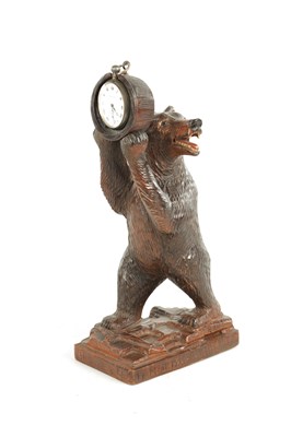 Lot 888 - A 19TH CENTURY SWISS BLACK FOREST CARVED LINDEN WOOD STANDING BEAR WATCH STAND