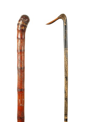 Lot 637 - A JAPANESE CARVED BAMBOO WALKING STICK TOGETHER WITH A CARVED WOODEN STICK