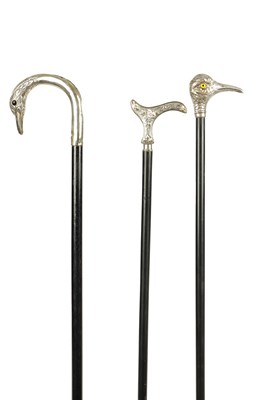 Lot 498 - A COLLECTION OF THREE FRENCH SILVER AND SILVER PLATE LADIES WALKING STICKS