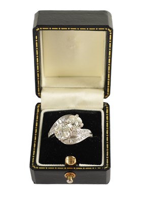 Lot 346 - A FINE PLATINUM SET CROSS-OVER TWO-STONE DIAMOND RING