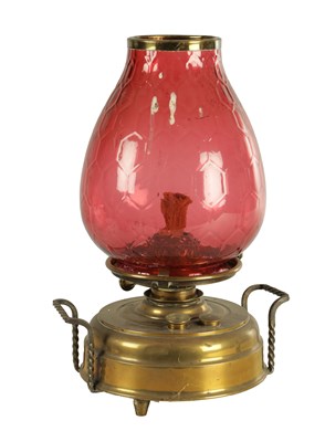 Lot 657 - A LATE 19TH CENTURY BRASS HEARTH LAMP
