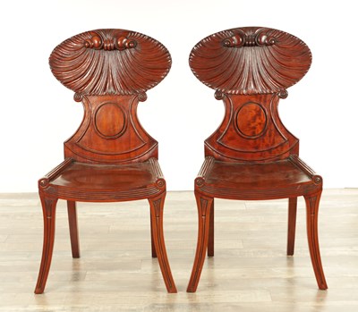 Lot 1389 - A PAIR OF REGENCY STYLE MAHOGANY HALL CHAIRS