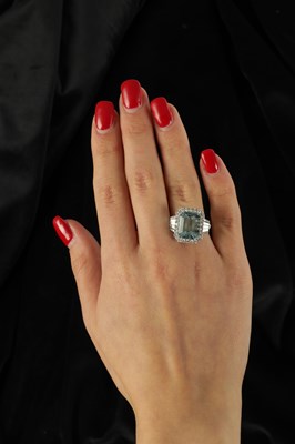 Lot 325 - A LADIES' 18CT WHITE GOLD AQUAMARINE AND DIAMOND RING