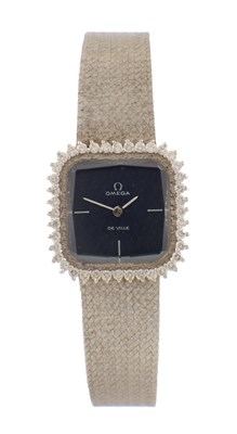 Lot 1412 - A LADIES 18CT WHITE GOLD AND DIAMOND SET OMEGA DE VILLE WRIST WATCH