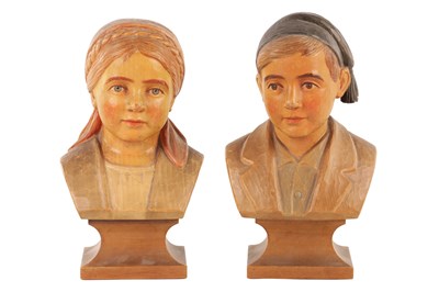 Lot 1152 - ATT. HANS HUGGLER WYSS. A PAIR OF SWISS CARVED PAINTE WOODEN BUSTS