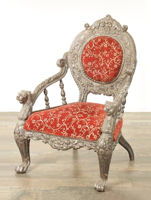 Lot 523 - A 19TH CENTURY INDIAN CARVED HARDWOOD PEWTER COVERED UPHOLSTERED ARMCHAIR