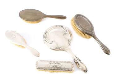 Lot 452 - A COLLECTION OF FOUR EARLY 20TH CENTURY DRESSING TABLE BRUSHES AND AN ART NOVEAU HAND MIRROR