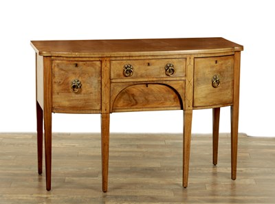 Lot 1348 - A GEORGE III BOW-FRONTED MAHOGANY SIDEBOARD