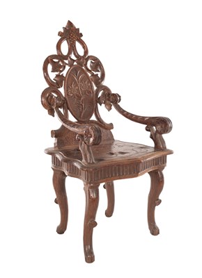 Lot 1160 - A 19TH CENTURY BLACK FOREST CARVED WALNUT CHILDS CHAIR BY EMILE EGGER