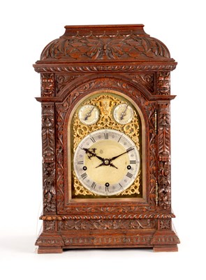 Lot 1528 - A LATE 19TH CENTURY GERMAN CARVED OAK QUARTER CHIMING BRACKET CLOCK