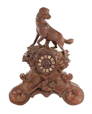 Lot 1630 - A LATE 19TH CENTURY BLACK FOREST CARVED LINDEN WOOD MANTEL CLOCK