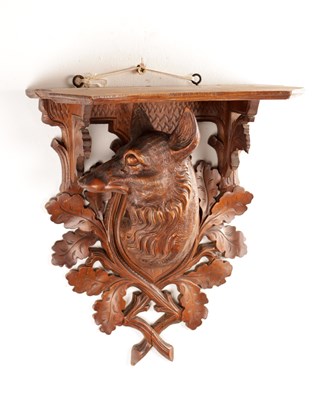 Lot 1118 - A LATE 19TH CENTURY BLACK FOREST CARVED LINDEN WOOD WALL BRACKET