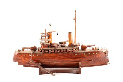Lot 950 - AN EARLY 20TH CENTURY WOODEN MODEL OF A GERMAN NAVAL WARSHIP