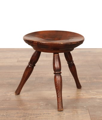 Lot 1349 - AN 18TH CENTURY FRUITWOOD DISHED STOOL