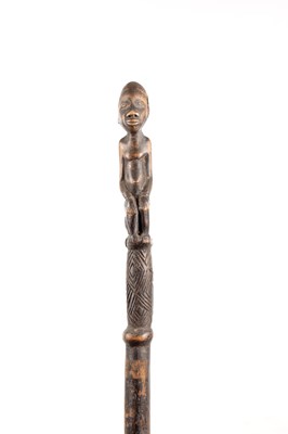 Lot 1084 - AN AFRICAN CARVED EBONISED WALKING CANE