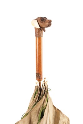 Lot 630 - A 19TH CENTURY CARVED BLACK FOREST DOGS HEAD PARASOL WITH SPRUNG ACTION MOUTH