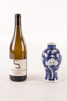 Lot 173 - A CHINESE BLUE AND WHITE PRUNUS VASE