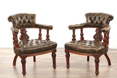 Lot 1225 - A PAIR OF VICTORIAN CARVED WALNUT AND BUTTON UPHOLSTERED LEATHER DESK CHAIRS