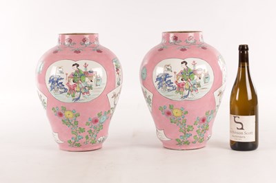 Lot 193 - A PAIR OF CHINESE FAMILLE ROSE PINK GROUND BALUSTER VASES