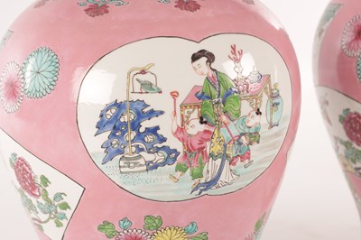 Lot 193 - A PAIR OF CHINESE FAMILLE ROSE PINK GROUND BALUSTER VASES