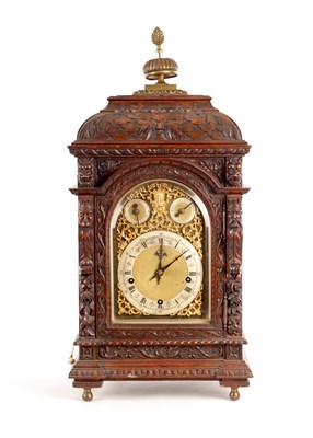 Lot 1637 - A LATE 19TH CENTURY GERMAN CARVED OAK QUARTER CHIMING BRACKET CLOCK