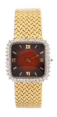Lot 1415 - A UNISEX 14CT GOLD DIAMOND SET WRIST WATCH BY PAUL BUHRE