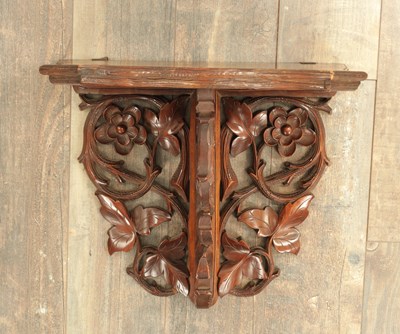 Lot 1106 - A LATE 19TH CENTURY BLACK FOREST CARVED HANGING WALL BRACKET