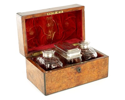 Lot 339 - A SET OF THREE GEORGE III SILVER TOPPED GLASS CADDIES IN ORIGINAL WALNUT BOX