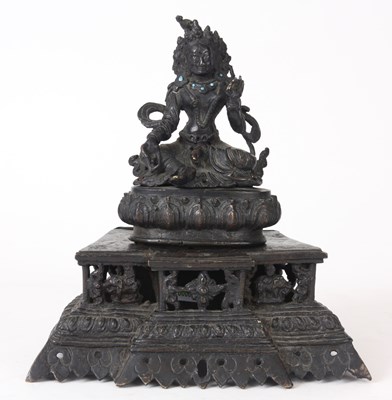 Lot 117 - AN EARLY TIBETAN SEATED BRONZE BUDDHA with...