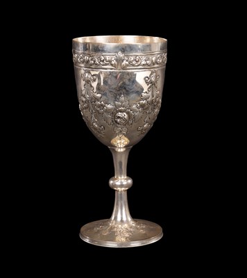 Lot 395 - A VICTORIAN EMBOSSED SILVER GOBLET OF LARGE SIZE