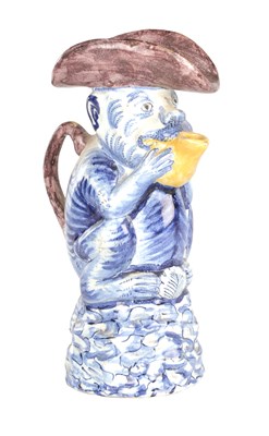 Lot 112 - A 19TH CENTURY DUTCH DELFT TOBY JUG MODELLED AS A MONKEY
