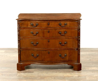 Lot 1165 - A LATE GEORGIAN CHIPPENDALE STYLE MAHOGANY SERPENTINE CHEST OF DRAWERS