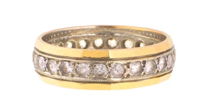 Lot 573 - A 9CT YELLOW GOLD AND DIAMOND ETERNITY RING