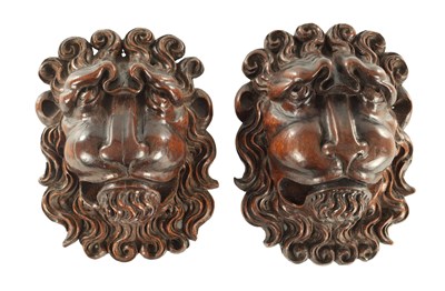 Lot 1114 - A PAIR OF 18TH CENTURY CARVED WALNUT LIONS HANGING MASKS