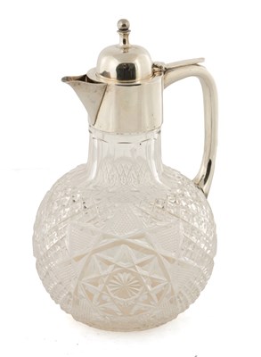 Lot 283 - A VICTORIAN CUT GLASS AND SILVER-MOUNTED GLOBULAR CLARET JUG