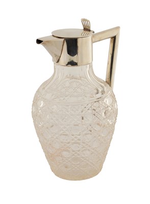 Lot 478 - A SILVER TOPPED CUT GLASS SHOULDERED CLARET JUG