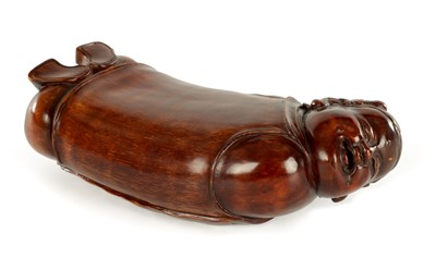 Lot 188 - A CARVED CHINESE PALM WOOD FIGURAL OPIUM PILLOW