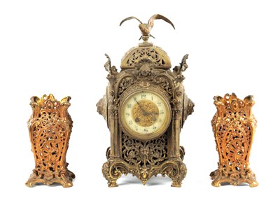 Lot 1567 - A 19TH CENTURY FRENCH GILT BRASS THREE PIECE CLOCK SET