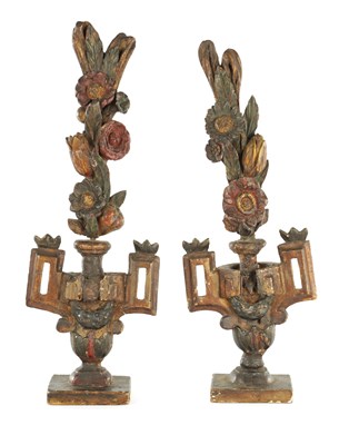Lot 1124 - A PAIR OF EARLY DUTCH CARVED WOOD POLYCHROME DECORATED URNS