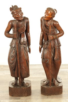 Lot 125 - A LARGE PAIR OF 19TH CENTURY ORIENTAL CARVED HARDWOOD FIGURES