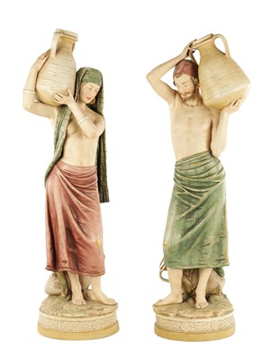 Lot 40 - A LARGE PAIR OF ROYAL DUX PORCELAIN FIGURES OF WATER CARRIERS
