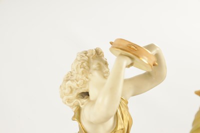 Lot 71 - A PAIR OF LATE 19TH CENTURY BLUSH IVORY ROYAL WORCESTER FIGURES OF MUSICIANS
