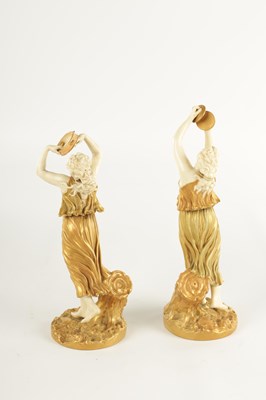 Lot 71 - A PAIR OF LATE 19TH CENTURY BLUSH IVORY ROYAL WORCESTER FIGURES OF MUSICIANS