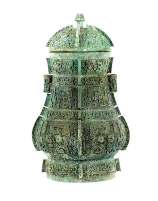 Lot 190 - A CHINESE PATINATED BRONZE RITUAL POURING VESSEL AND COVER