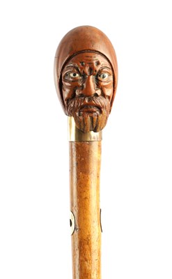 Lot 639 - A 19TH CENTURY CARVED COQUILLA NUT HANDLE WALKING STICK
