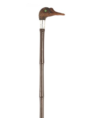Lot 631 - A LATE 19TH CENTURY CARVED AND PAINTED DUCK'S HEAD WOODEN WALKING STICK